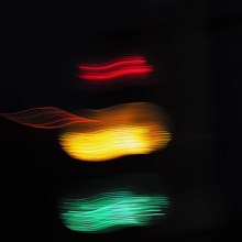 Lights of a traffic light in the dark