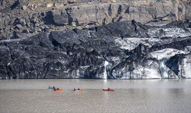 Kayaker on glacial lake