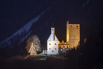 Freundsberg Castle in winter at night