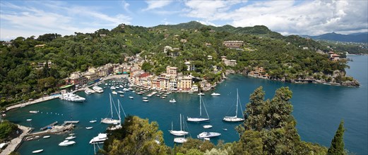 Panorama of bay harbour fishing village Portofino with sailing yachts and motor yachts