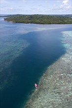 Sea level rising above reef top in tidal current channel