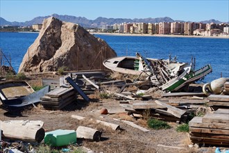 Boat cemetery on rocks by the sea off the coastal town of Aguilas