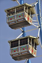 Painted gondolas in the air of Riesenrad