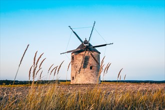 The Old Windmill of Tes in the sunset with guests
