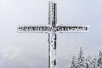 Snowy summit cross