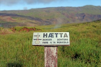 Sign warning of hot springs and heat in a geothermal field