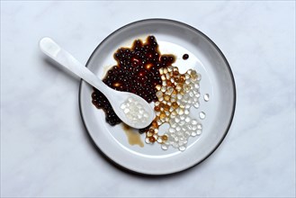 Aceto pearls with spoon in bowl