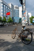 Rusty bicycle standing in front of the Chinese Embassy on Maerkisches Ufer
