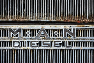 MAN Diesel emblem on the radiator grille of a MAN truck