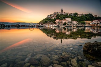 Historical village by the sea. Bay with harbour in the morning