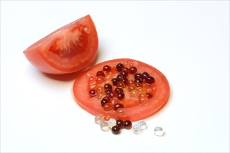 Aceto pearls on tomato slice