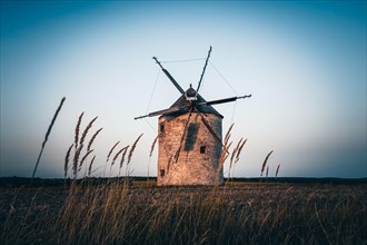The Old Windmill of Tes in the sunset with guests