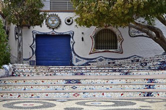 Staircase to closed restaurant with mosaics