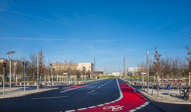 Red marked cycle path at the Federal Chancellery