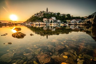 Historical village by the sea. Bay with harbour in the morning