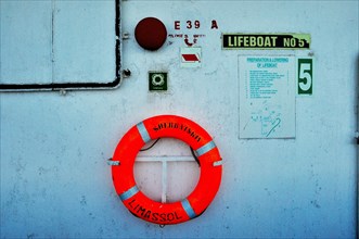 Red lifebelt on ferry