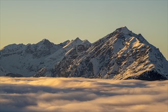 Winter mountain landscape with closed fog cover over the Inn valley