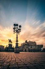 Theatre square with Semper Opera and equestrian monument at sunset