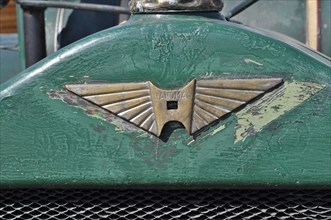 Hanomag logo on green metal from tractor