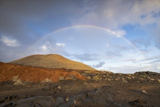 Rainbow and typical volcanic landscape at La Restinga