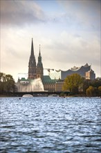 View of the Inner Alster Lake with City Hall church tower and Elbe Philharmonic Hall Hamburg