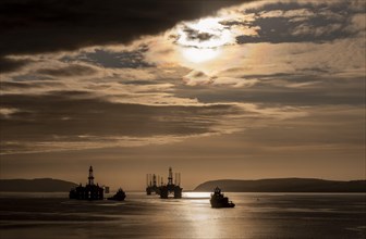 Oil rigs and a supply vessel in the harbour area of Invergordon