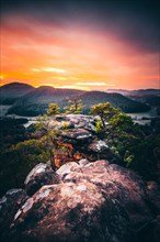 View from the sandstone rock Wachtfelsen to the sunrise