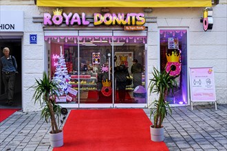 Red carpet in front of Royal Donuts shop