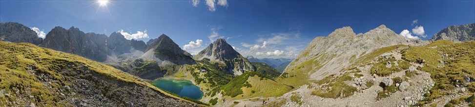 360 mountain panorama above the Drachensee and the Coburger Huette with the mountain peaks of the Sonnenspitze