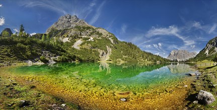 Mountain panorama at the turquoise Seebensee with the mountain peaks of the Sonnenspitze and the Wetterstein massif with reflection