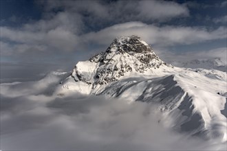 Summit of the Widderstein with mountains in the fog