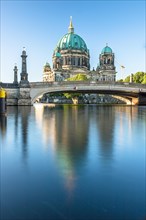 Berlin Cathedral on Museum Island with Friedrichsbruecke over the Spree