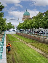 Mowing the lawn in the City channel in Yorckstrasse in Potsdam