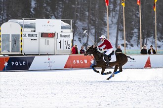 Robert Strom of Team St. Moritz rides across the field in full gallop