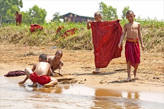 Bathing monks on the banks of the Nam Pilu River