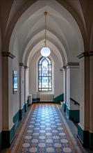 Staircase corridor with decorative windows in Sankt Hedwig Hospital
