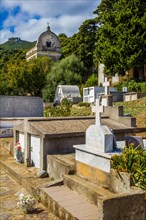 Rogliano on the hillside with several churches and a cemetery with magnificent family tombs