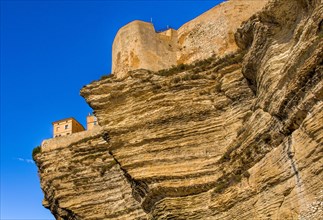 Steep coast of Bonifacio with old town on a limestone plateau