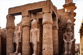 South doorway to the Great Colonnade with colossal statues of Ramses II. Luxor Temple