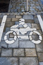 Parking space marking on pavement with motorbike pictogram in Kempten Allgaeu