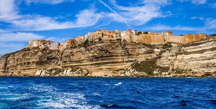 Steep coast of Bonifacio with old town on a limestone plateau