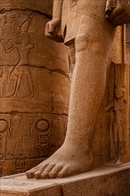 Figure of the Royal Wife Nefertari on the right leg of Ramses II. Luxor Temple