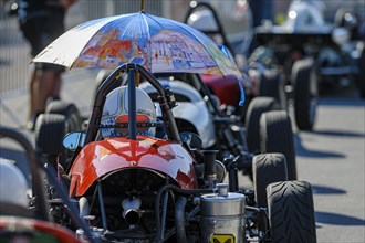 Historic race cars in waiting position