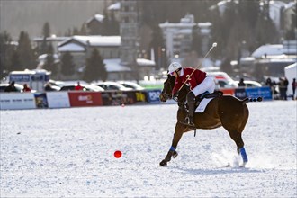 Robert Strom of Team St. Moritz hits the ball