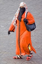 Traditionally dressed woman on the Jemaa El-Fna