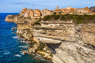 Steep coast of Bonifacio with old town on a limestone plateau