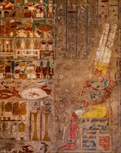 Hall of columns in the Anubis Chapel: Amun is sitting on his throne in front of the offerings which Hatshepsut