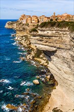 Steep coast of Bonifacio with old town on a limestone plateau