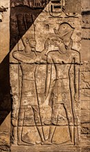 God Amun with the Pharaoh in a chapel