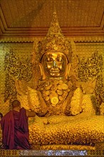 Buddha statue dressed in gold plate